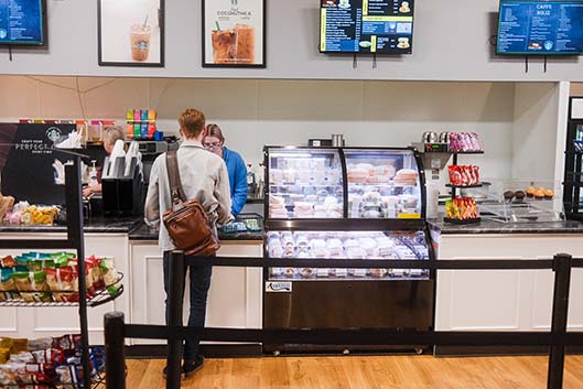 NE student Samuel Husted checks out of the Caffe Noliz location found in NSTU. Locations can be found across the district. The cafe offers grab-and-go food options as well as drinks. KJ Means/The Collegian