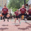 NW Dance Mosaic Project members Jesse Martinez, Andrea Faber and Audrey Derbyshire jump during their Main Street Arts Festival performance April 20. Alex Hoben/The Collegian