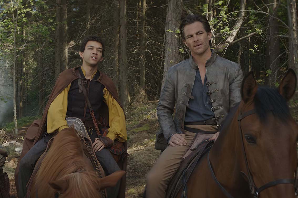 Chris Pine and Justice Smith’s characters Edgin the Bard and Simon the sorcerer on top of horses as they travel around the magical realm of “Dungeons and Dragons: Honor Among Thieves.” The movie premiered in theaters on March 31. Photo courtesy of Paramount Pictures
