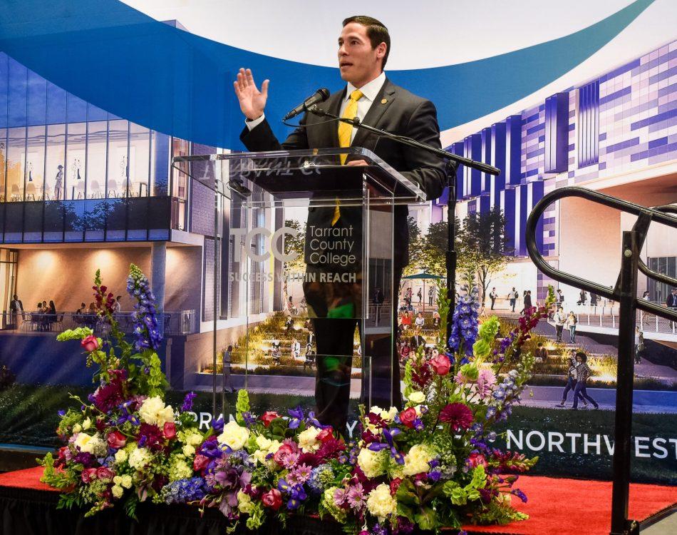 Fort Worth city council member Carlos Flores giving a speech during the ceremony. Flores said that TCC is integral to the infrastructure of the Fort Worth community. Alex Hoben/The Collegian.
