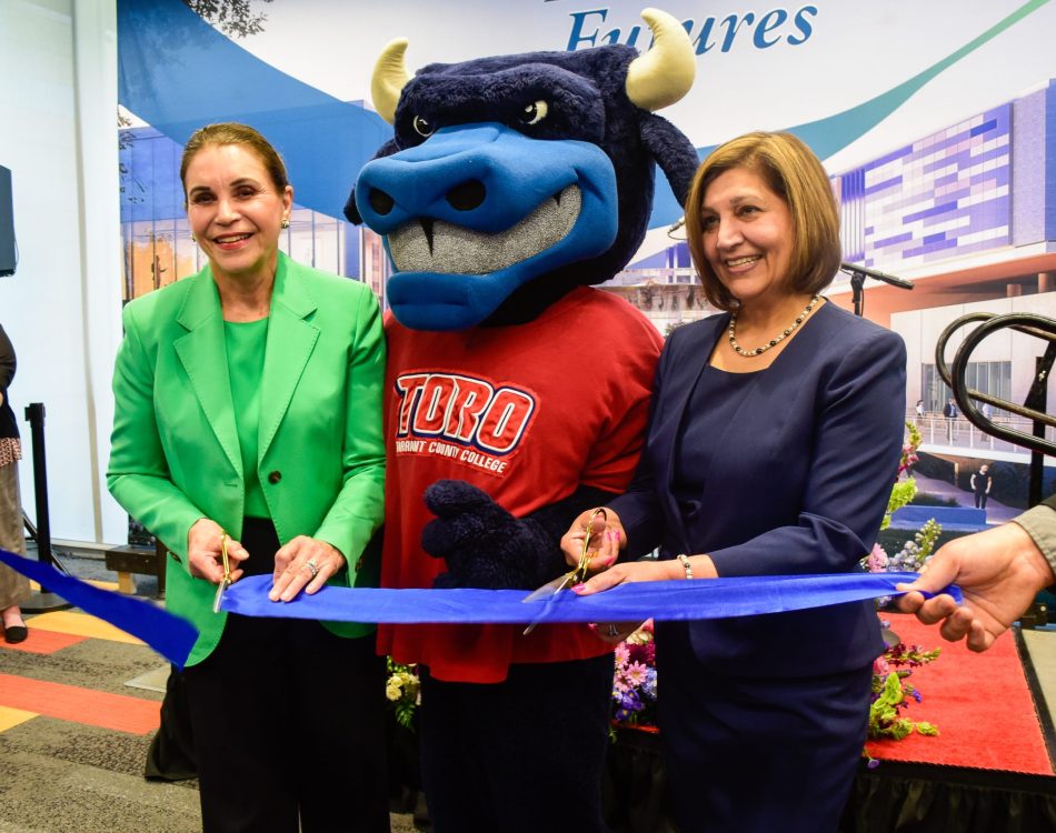 TCC chancellor Elva LeBlanc and NW Campus President Zarina Blankenbaker stand with TCC mascot Toro to cut the ribbon again at the ceremony. Alex Hoben/The Collegian