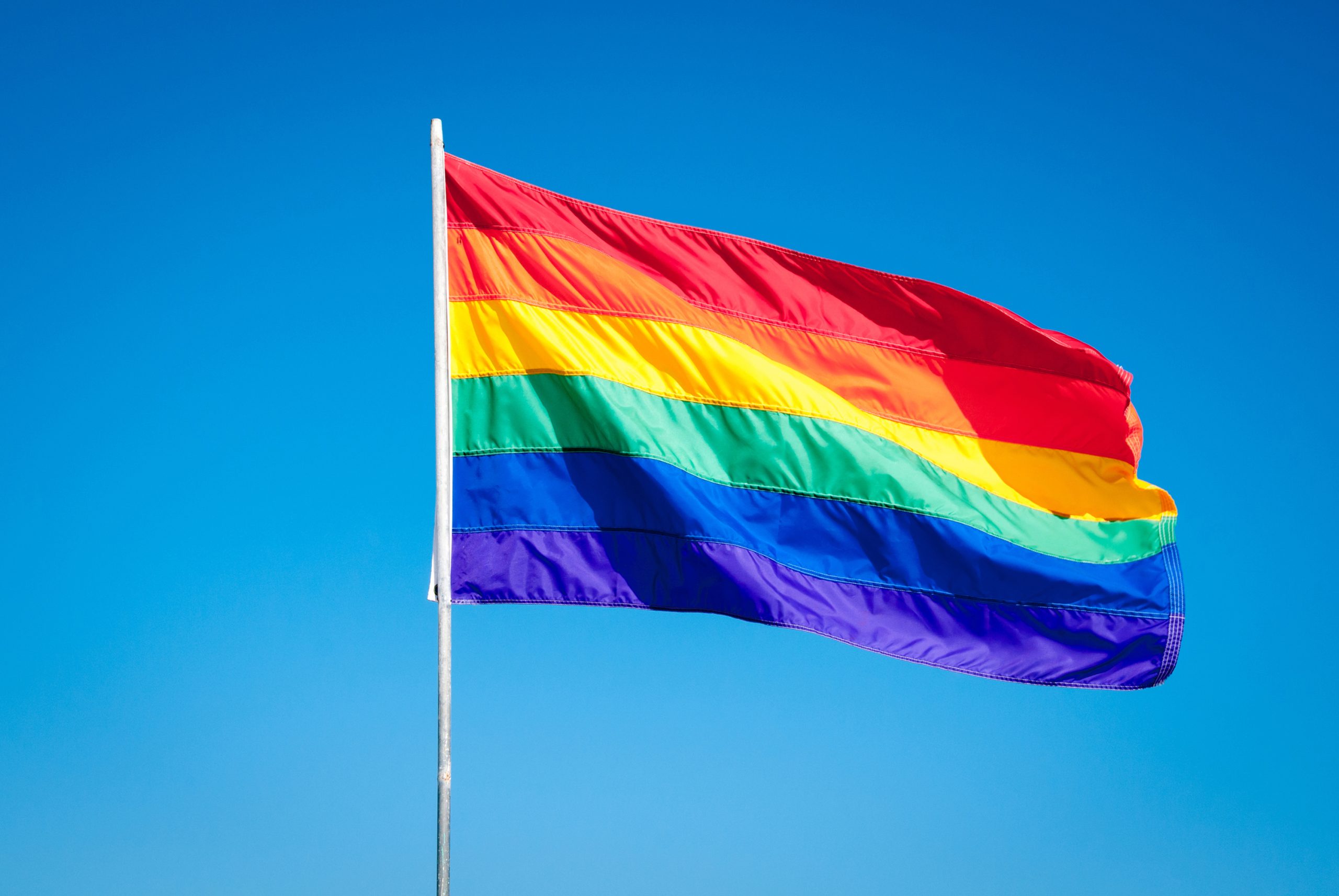 The Gay Pride flag flies in Miami. Disneyland will hold its first officially sanctioned Pride Nite as an after-hours ticketed event this summer. (Alexander Demyanenko/Dreamstime/TNS)