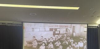 Olla Mokhtar/The Collegian Richard Gonzalez presents to a group of students the history of Latino education with a picture of students in one of the first Latino schools.