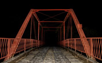 Alex Hoben/The Collegian Found between Denton and Argyle, the Old Alton Bridge is host to many haunting ghost stories. The most frightening being tales of a supposed Goat Man whose eyes you can see glowing in the distance.