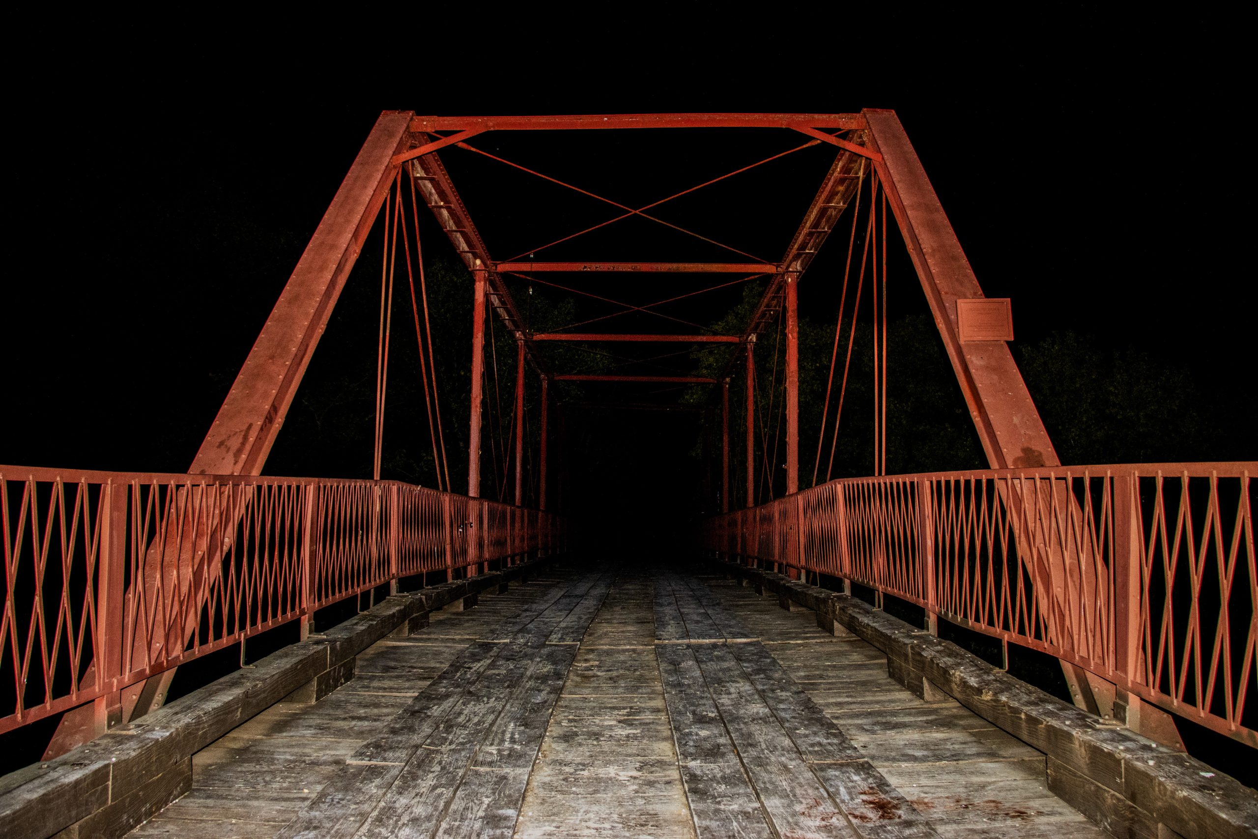 Alex Hoben/The Collegian Found between Denton and Argyle, the Old Alton Bridge is host to many haunting ghost stories. The most frightening being tales of a supposed Goat Man whose eyes you can see glowing in the distance.
