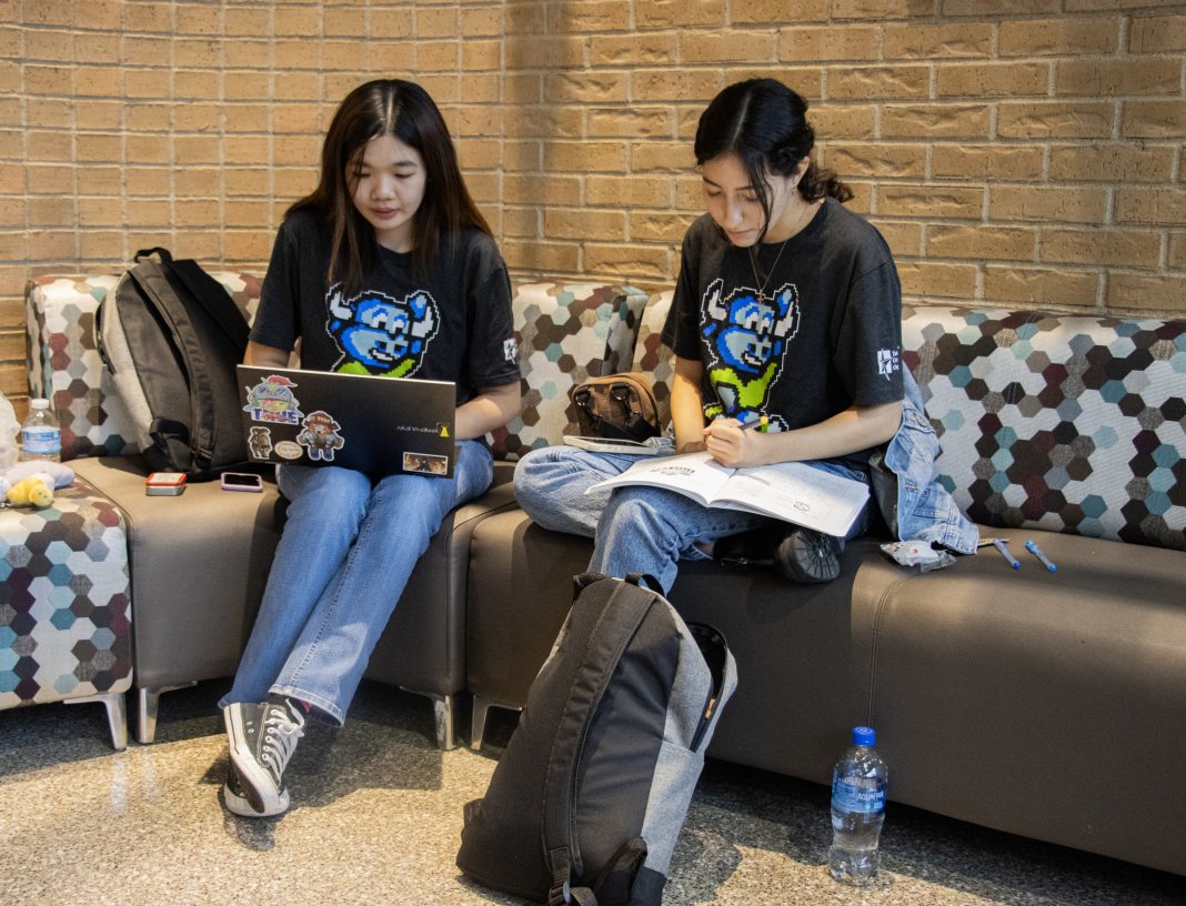 Alex Hoben/The Collegian NE students Mimi Nguyen and Victoria Baeza work on assignments in the study areas in NSTU. Nguyen said that the Wi-Fi in buildings such as NSCE is unstable at best when connected to.