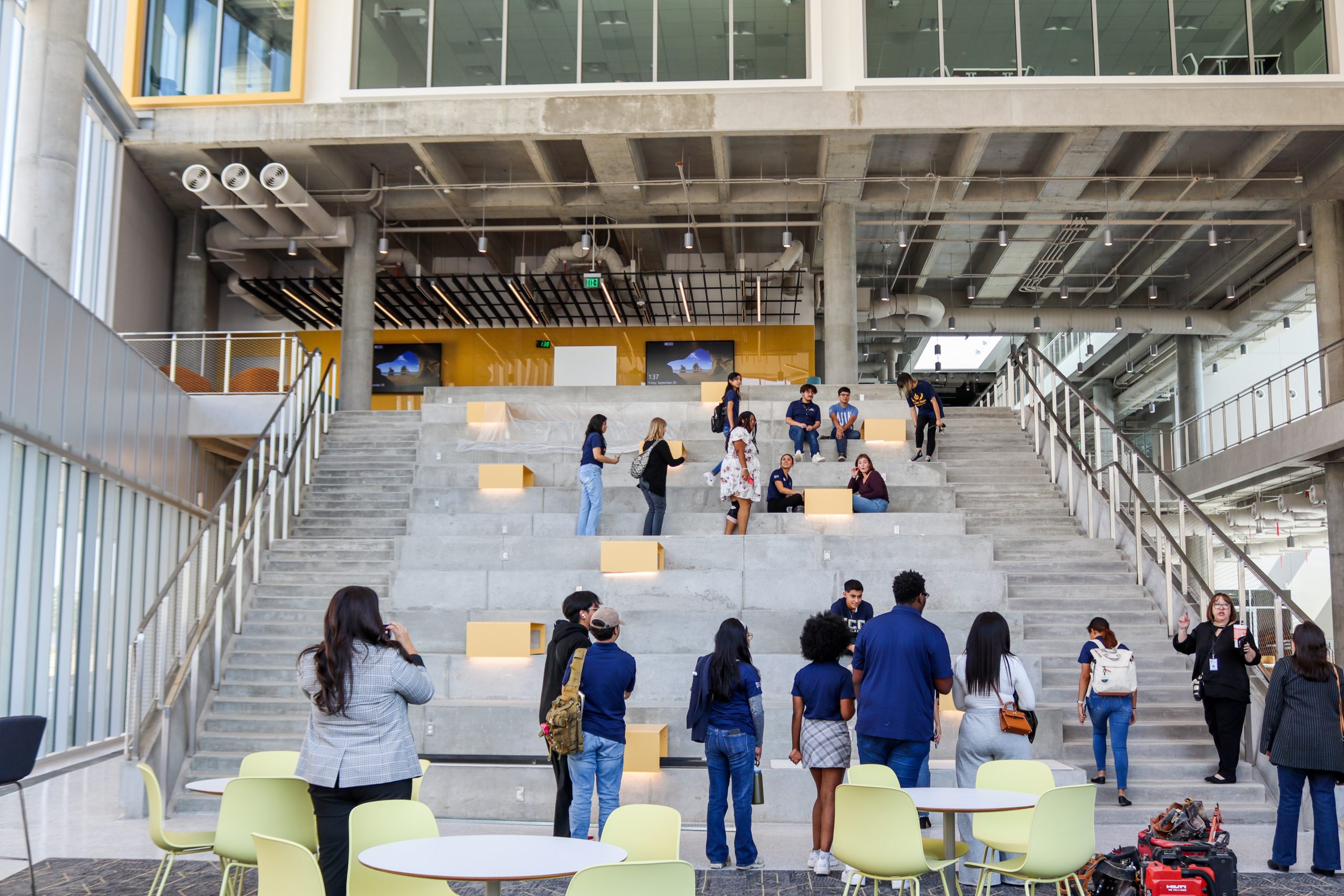 Hope Smith/The Collegian Students explore the grand staircase in the new NW01 building set to open this month.