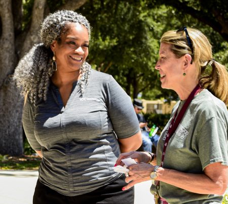 File photo/The Collegian Kenya Ayers-Palmore, left, talks to a faculty member during the Welcome Week event on NE Campus in August. Ayers-Palmore was fired as NE president Oct. 27.