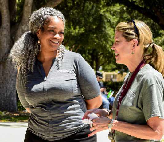 File photo/The Collegian Kenya Ayers-Palmore, left, talks to a faculty member during the Welcome Week event on NE Campus in August. Ayers-Palmore was fired as NE president Oct. 27.