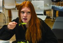 Alex Hoben/The Collegian NE student Aila Sherman eats a salad from Caffe Noliz, the cafe can be found in NSTU. The on-campus eating establishment offers Starbucks drinks, pastries and meals. Caffe Noliz opened earlier this year across the district.