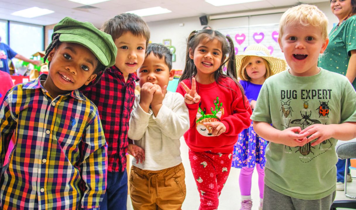 Rama Aljouni/The Collegian Children at the NE Childcare Center getting ready for their tea and cookies party while wearing their different hats. The kids were able to celebrate with their families.