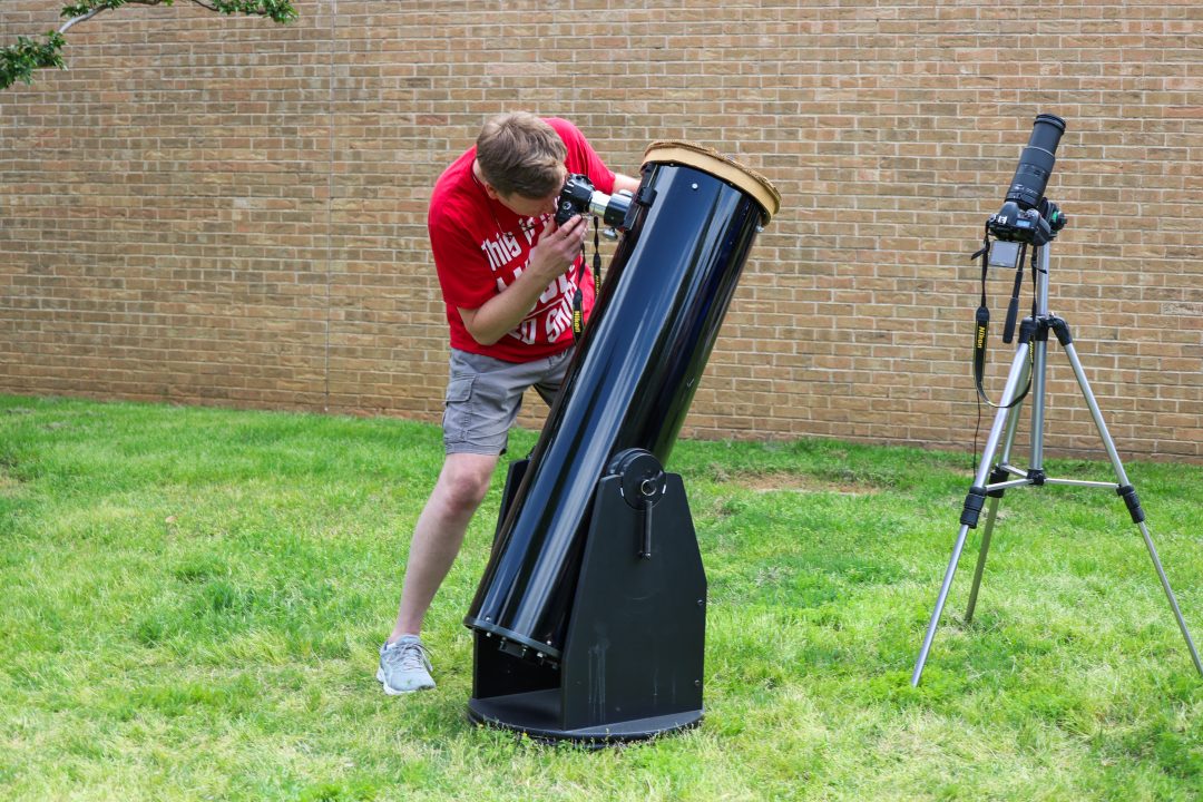 Fousia Abdullahi/The Collegian Community member Dan Hester brought his telescope with a 10-inch mirror to the NE eclipse watch party.