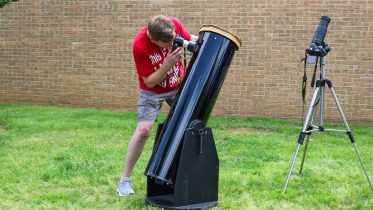 Fousia Abdullahi/The Collegian Community member Dan Hester brought his telescope with a 10-inch mirror to the NE eclipse watch party.