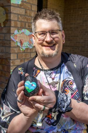 Alex Hoben/The Collegian Justin Thyme has painted multiple rocks and hidden them. Each rock has a unique design and QR code on the back linking to the @rockhound Instagram.