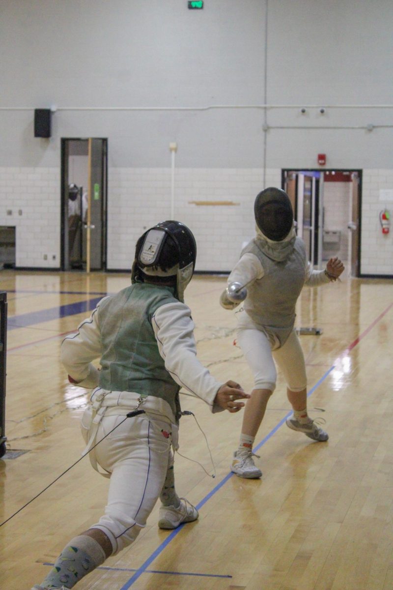 South Campus Student Anne Phan works on her reach during her lunges at a
fencing practice.