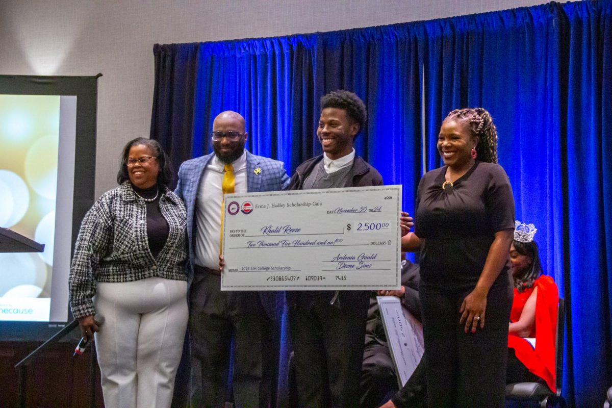 James Martin High School senior Khalil Reese receives the 2024 Erma C. Johnson Hadley scholarship. 