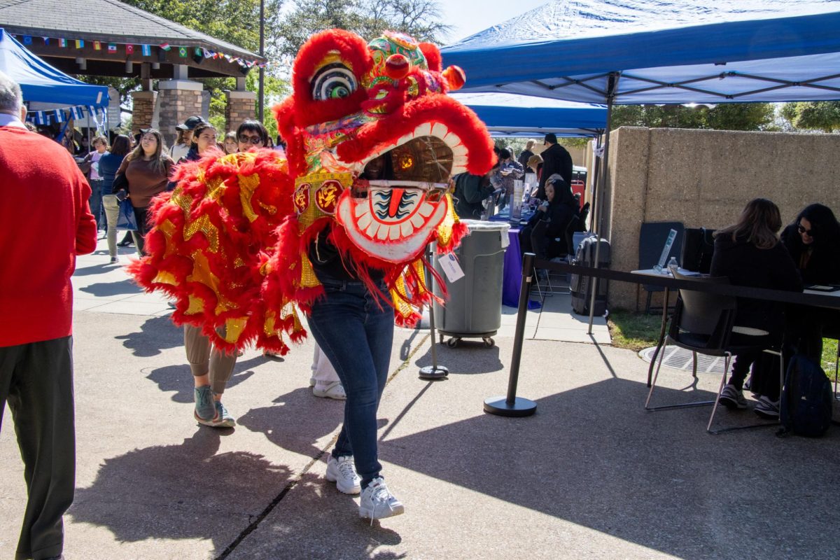 Students were also able to try on a traditional lion dance and dance across the courtyard.