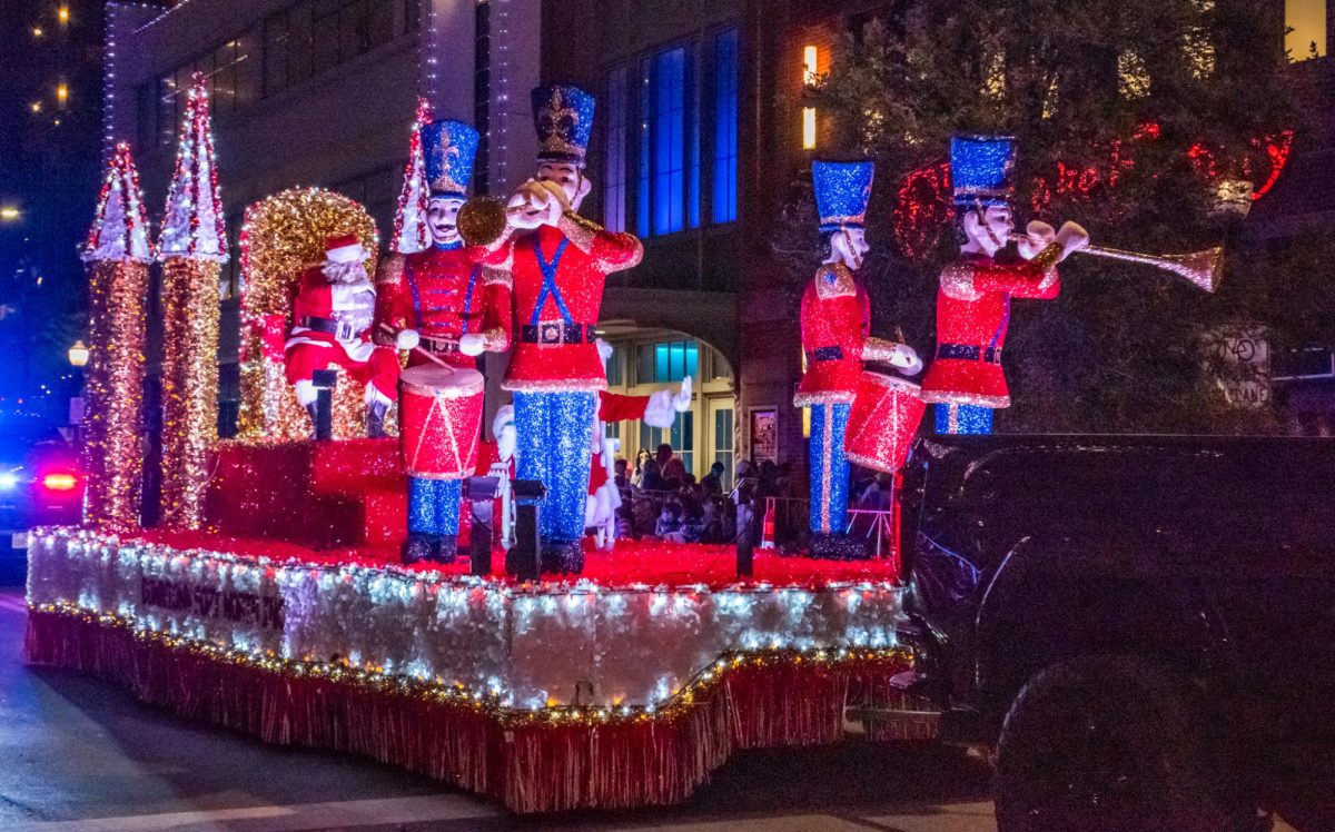 Santa ends the parade with a float featuring toy soldiers and Mrs. Claus.