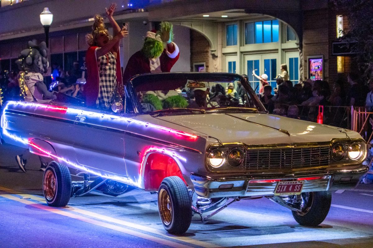 At the end of the Sweet Dreams Car Club procession was a low-rider with the Grinch and Cindy Lou-Who as passengers. The car was using hydraulics to bounce up and down.