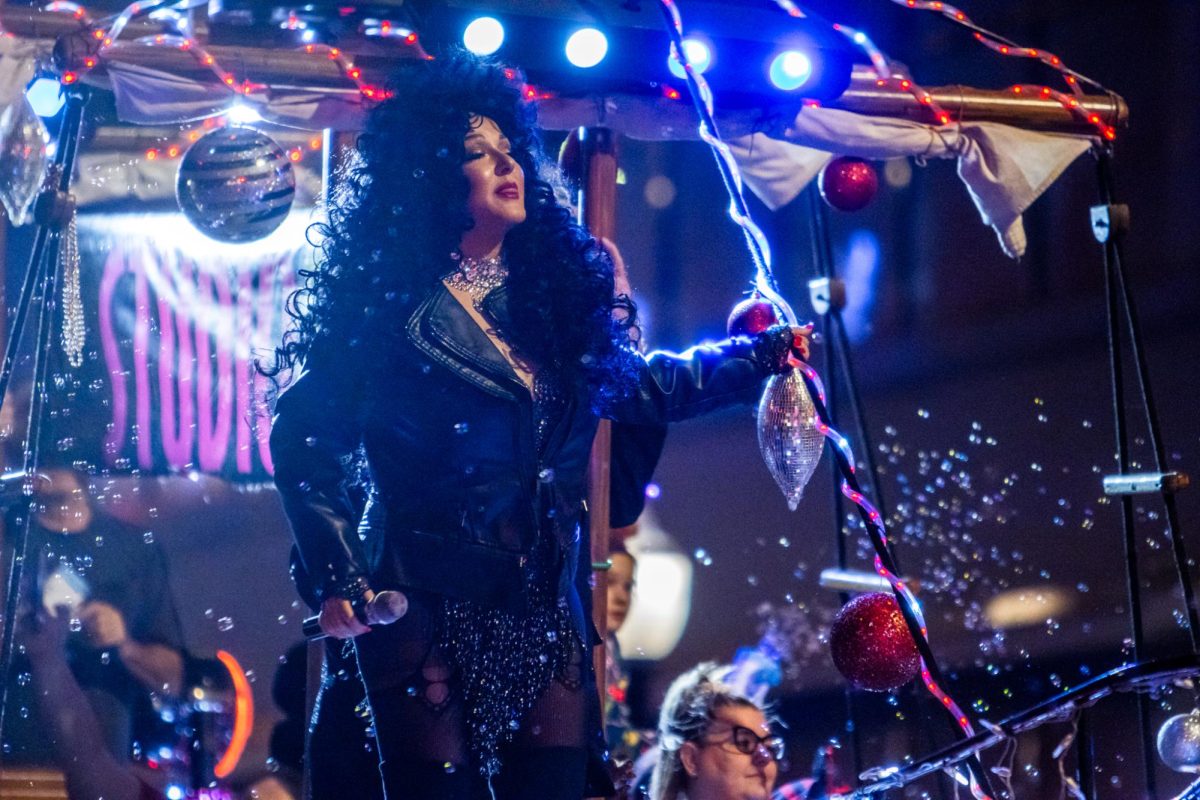 On the Studio 80 "Holiday on the Seven Seas" float, celebrity impersonator Rhonda Medina sang along to Cher songs while dressed as the pop star herself.