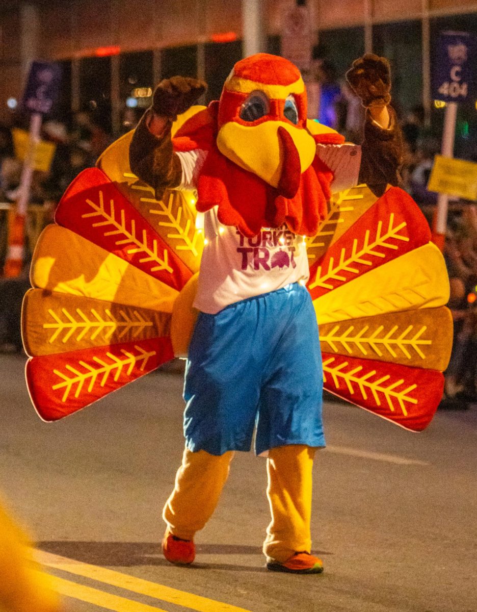 Walking in front of the YMCA of Metropolitan Fort Worth truck, a turkey mascot for the Turkey Trot marathon led the way.