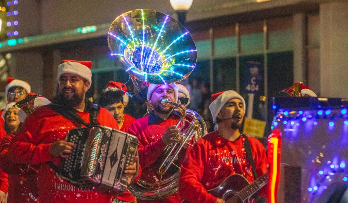 VIP Kings Barber College included a lit up band performing as they walked down the street.