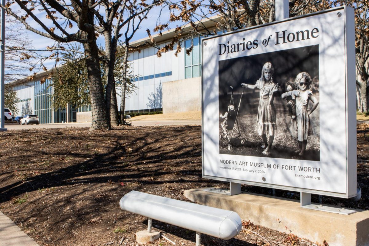 Sign with Sally Mann’s piece “The New Mothers” in front of the Modern Art Museum of Fort Worth advertises the Diaries of Homes exhibit featuring multiple artists.