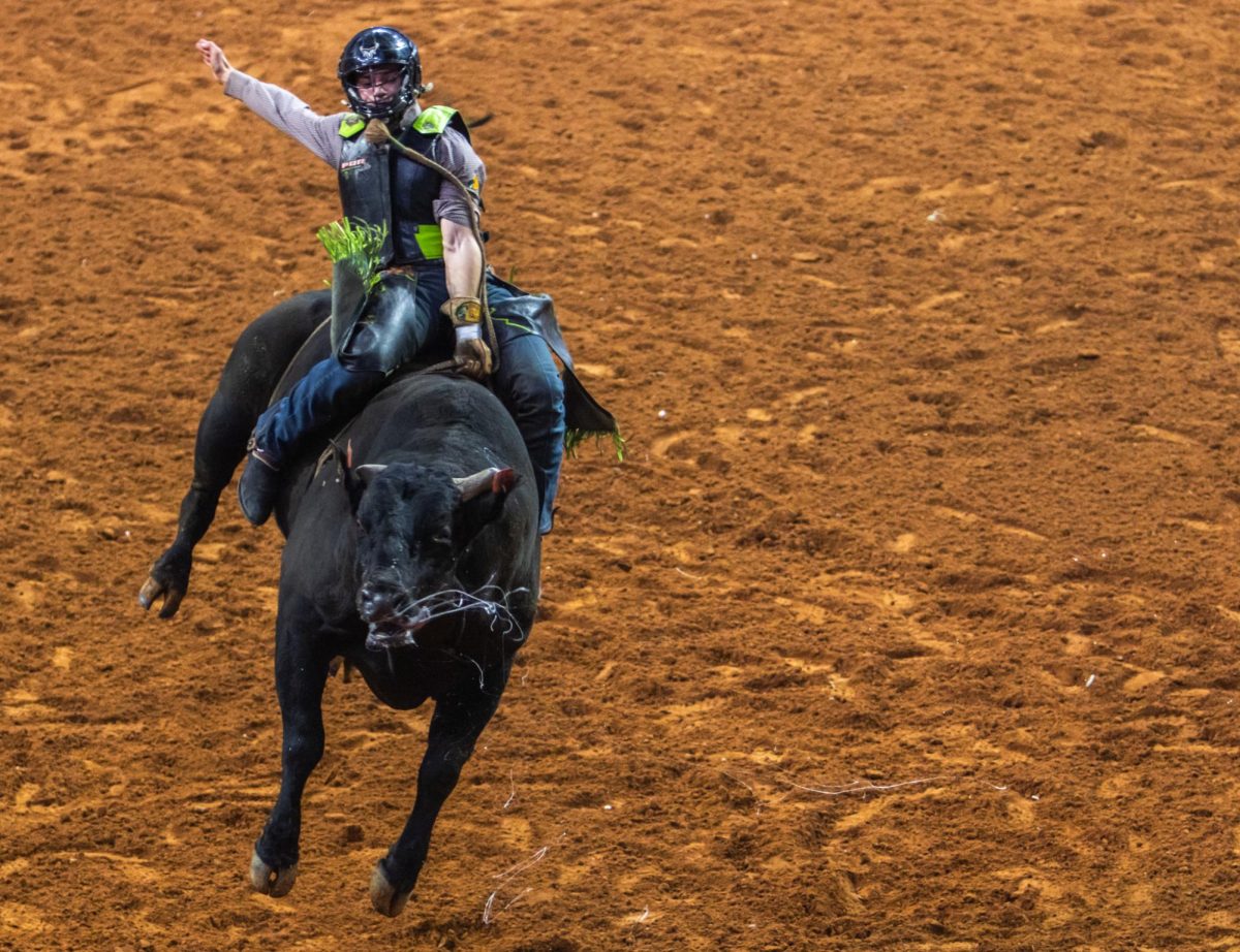 Felipe Furlan, member of the team Missouri Thunder, holds onto the bull “Throwing Hands” during the first night of Last Cowboy Standing.