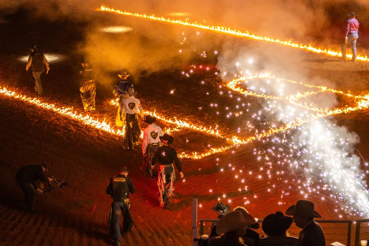 To kick off the first night of the competition, 40 of the top bull riders
walk out onto the Dickies Arena floor in a showering of fireworks.