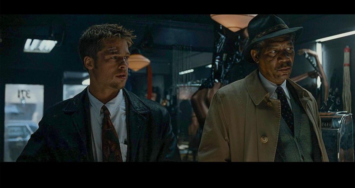 Detective David Mills, played by Brad Pitt, and Detective William Somerset, played by Morgan Freeman, are partnered together to investigate a serial killer in "Seven."