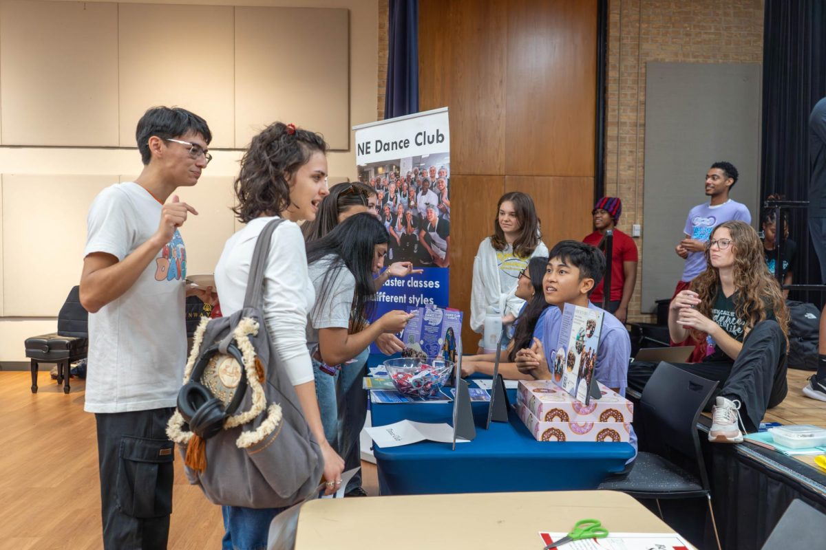 Movers Unlimited member Ethan Bui mans the information table with fellow student Anjelinu Santibanez to recruit students into the Dance Club on NE Campus. The club features different styles of dance like contemporary, hip hop and jazz.