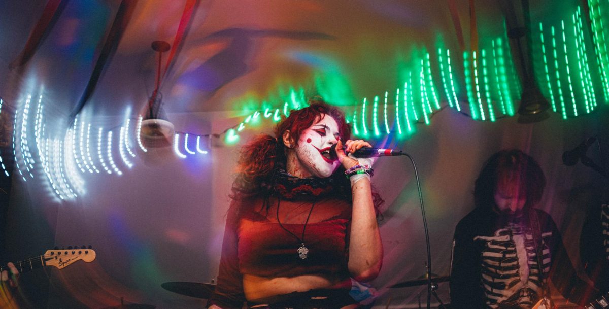 Lore Love. the main singer of the band, Dead week, performs at Bruised House, the house venue they run.