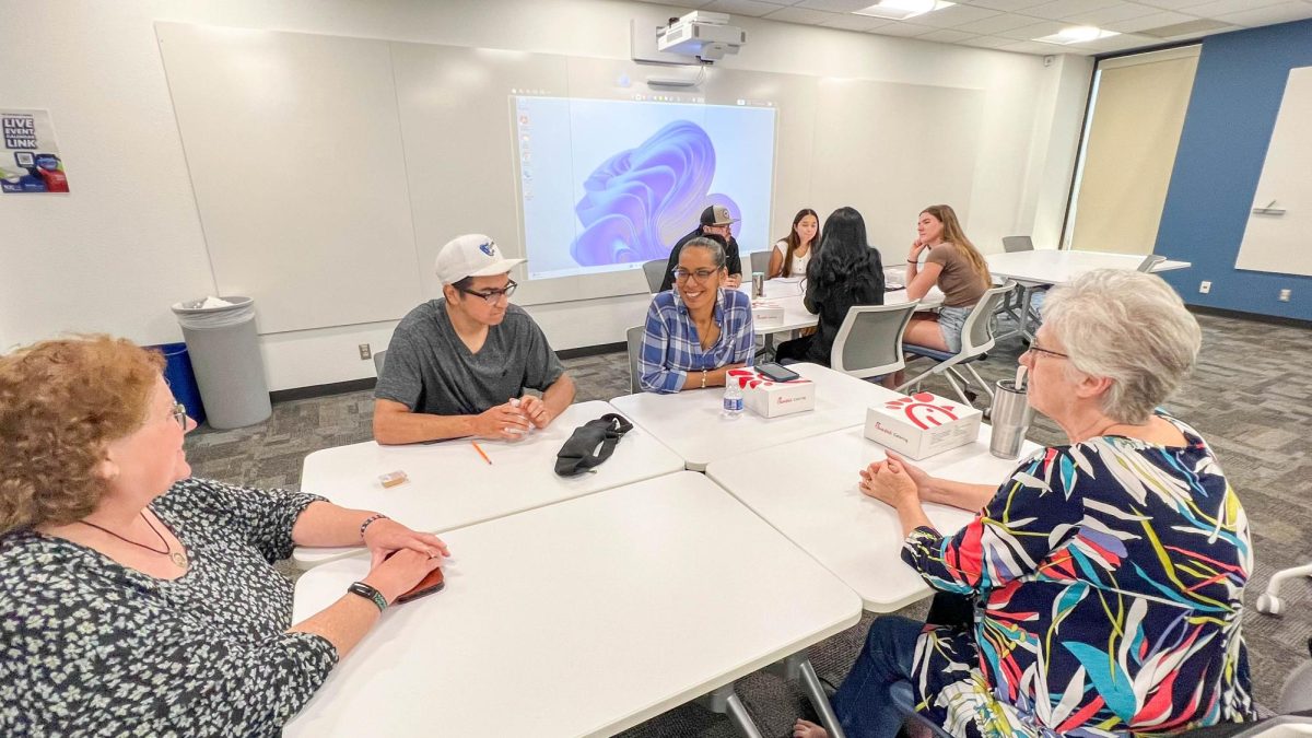 English for Speakers of Other Languages and Spanish Students practice what they've learned in class for event.
