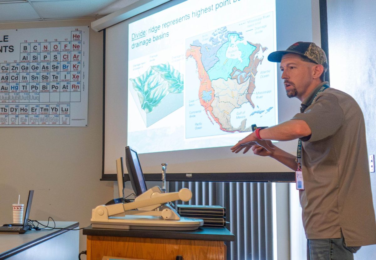 NE geology instructor Mathew Cope teaches about drainage basins during his class.