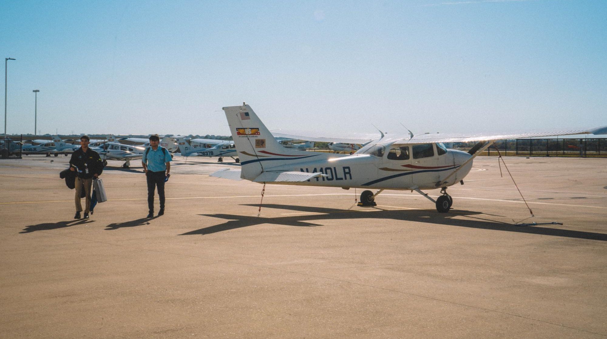 Student and AAS Instructor, walking outside where planes are parked outside of the airport apron parkway Erma C. Johnson Hafley Center of excellence Nov. 14. 