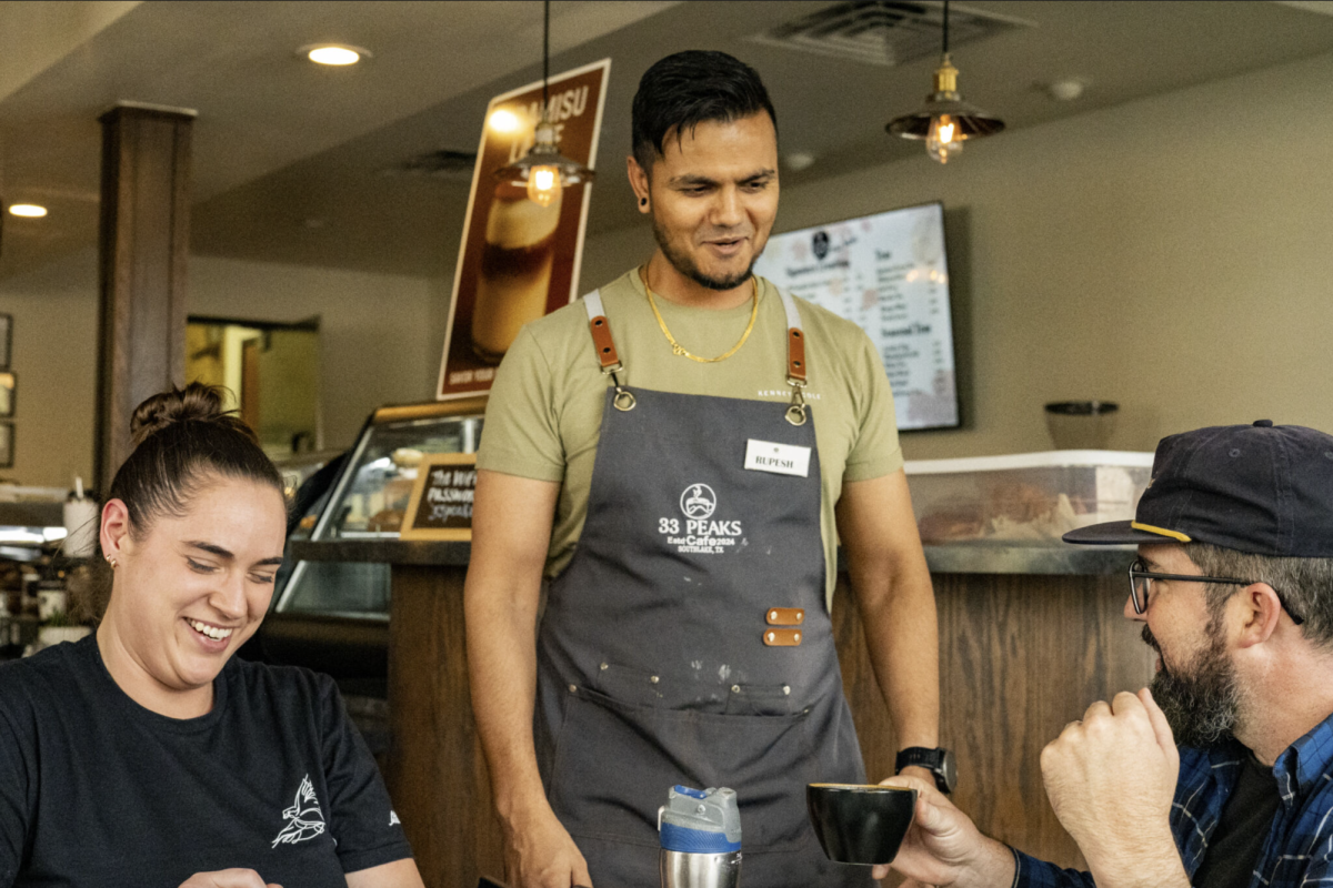 33 Peaks co-owner Rupesh Neupane talks with customers over a fresh cup of coffee in Southlake, just 20 minutes away from NE.
