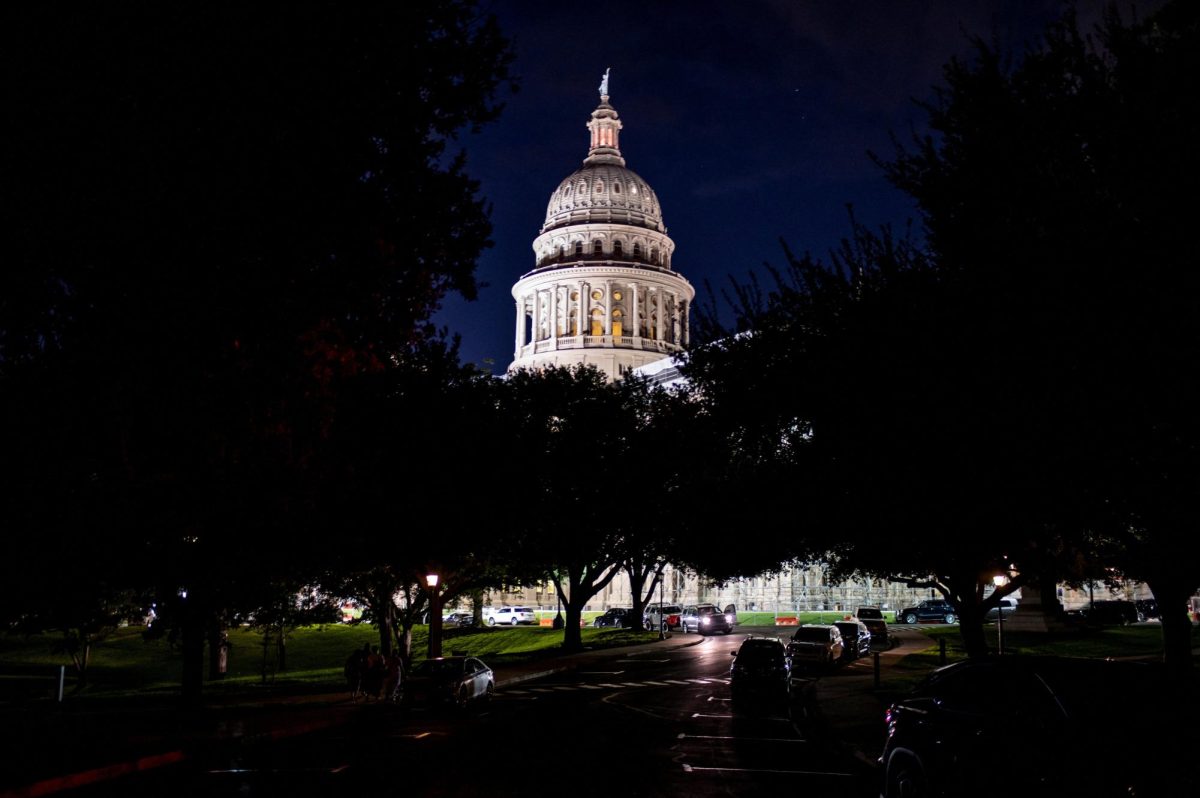 The Texas Capitol is lit during a session in the State Senate in Austin, Texas, U.S. August 22, 2025. REUTERS/Sergio Flores