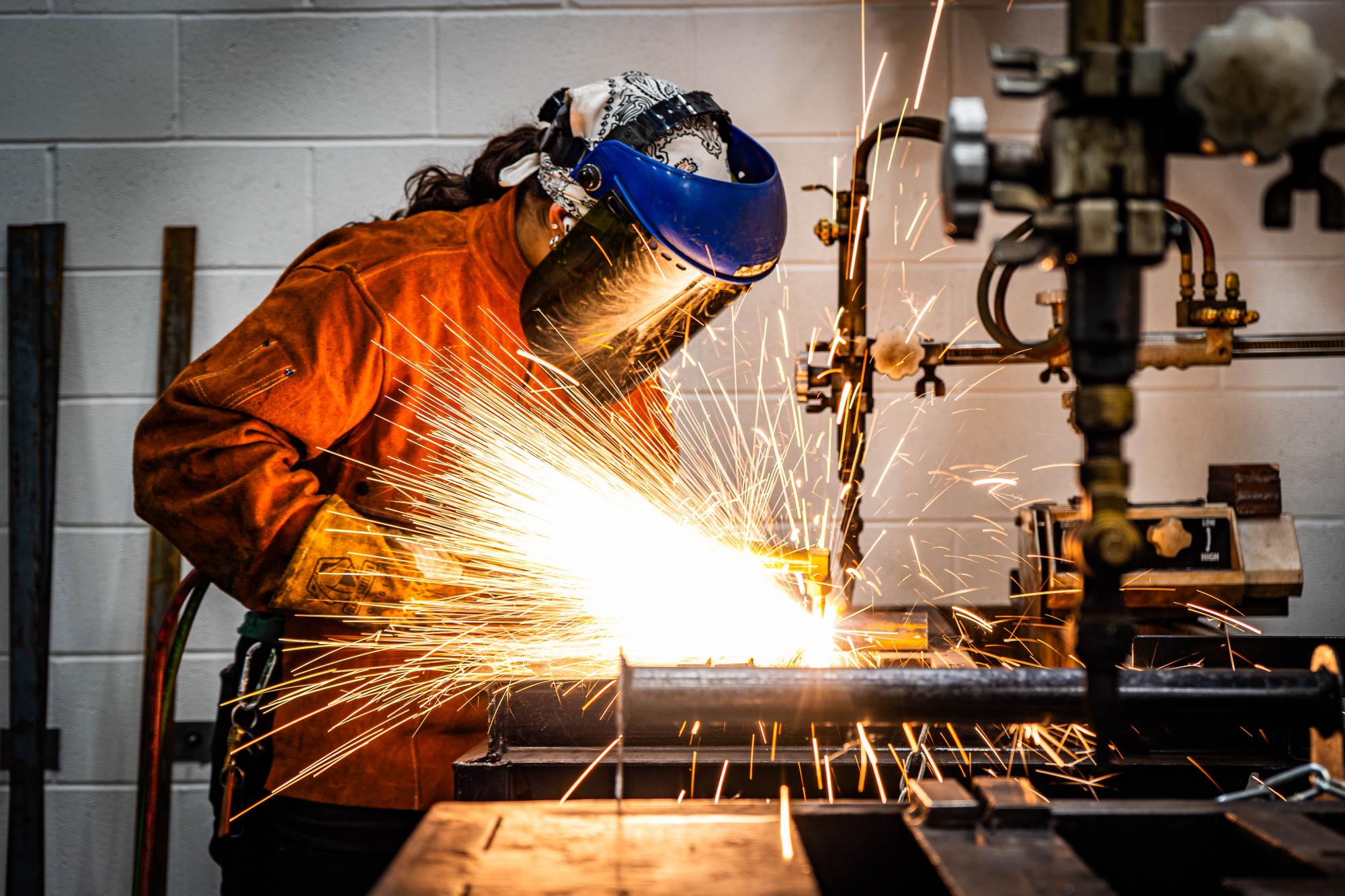 NW Welding student Mariangela Bassett-Lupovici performs oxy fuel cutting on her base metal at the Erma C. Johnson Hadley Center of Excellence for Aviation, Transportation and Logistics. 