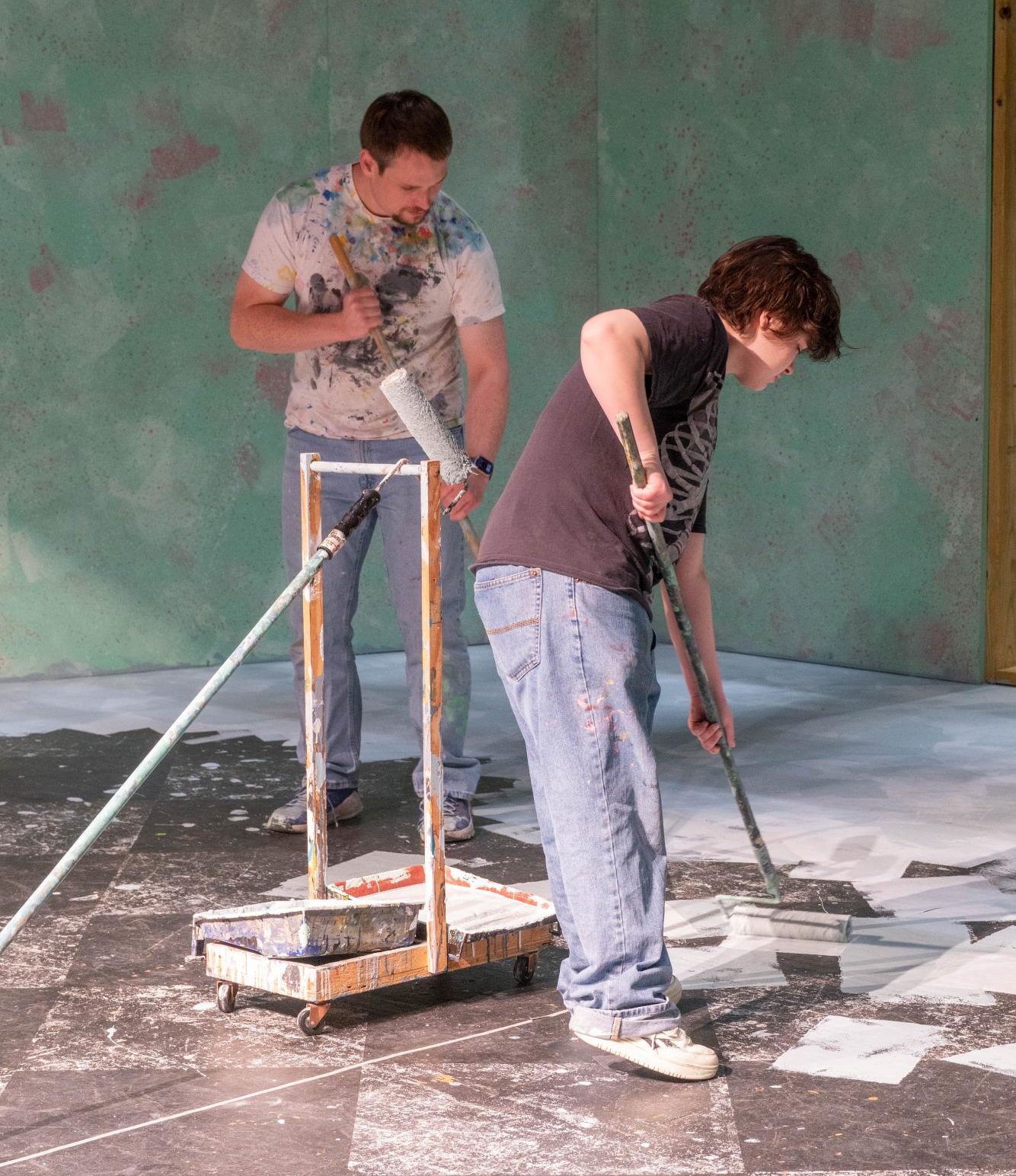Share Morando and Leo Brewer paint the stage for NE Campus' play Tartuffe.