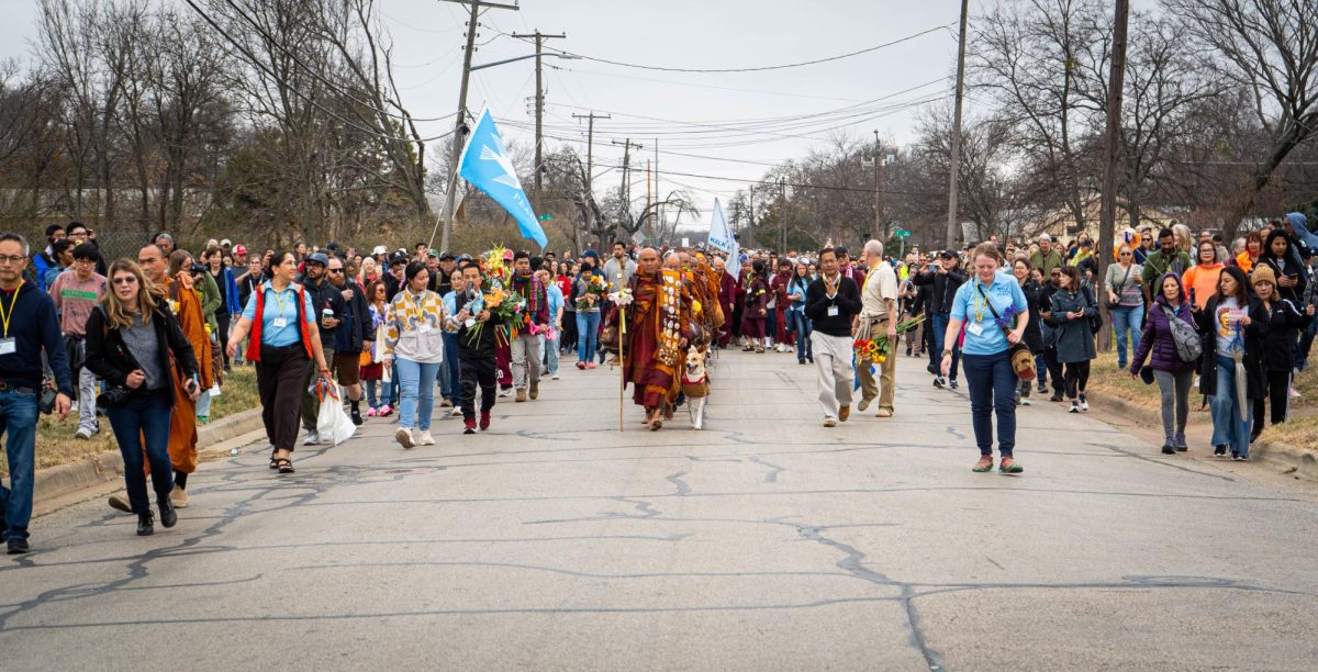 Theravada Buddhist monks and there 100 supporters walk back to the temple from there mile walk Feb.16. 