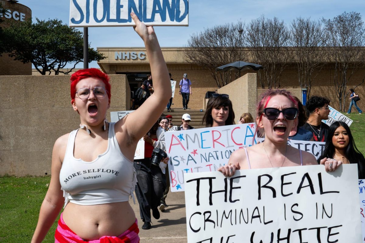 NE students march across campus during ICE walkout.