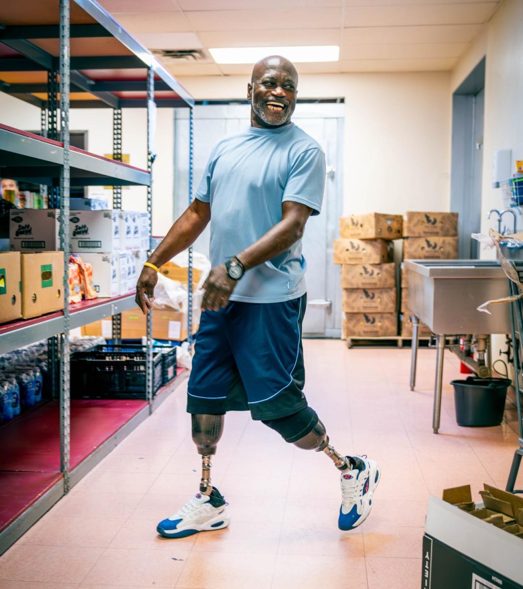NW student Vangregory Grinnon volunteers in the Northside Inter-Community Agency food pantry. 