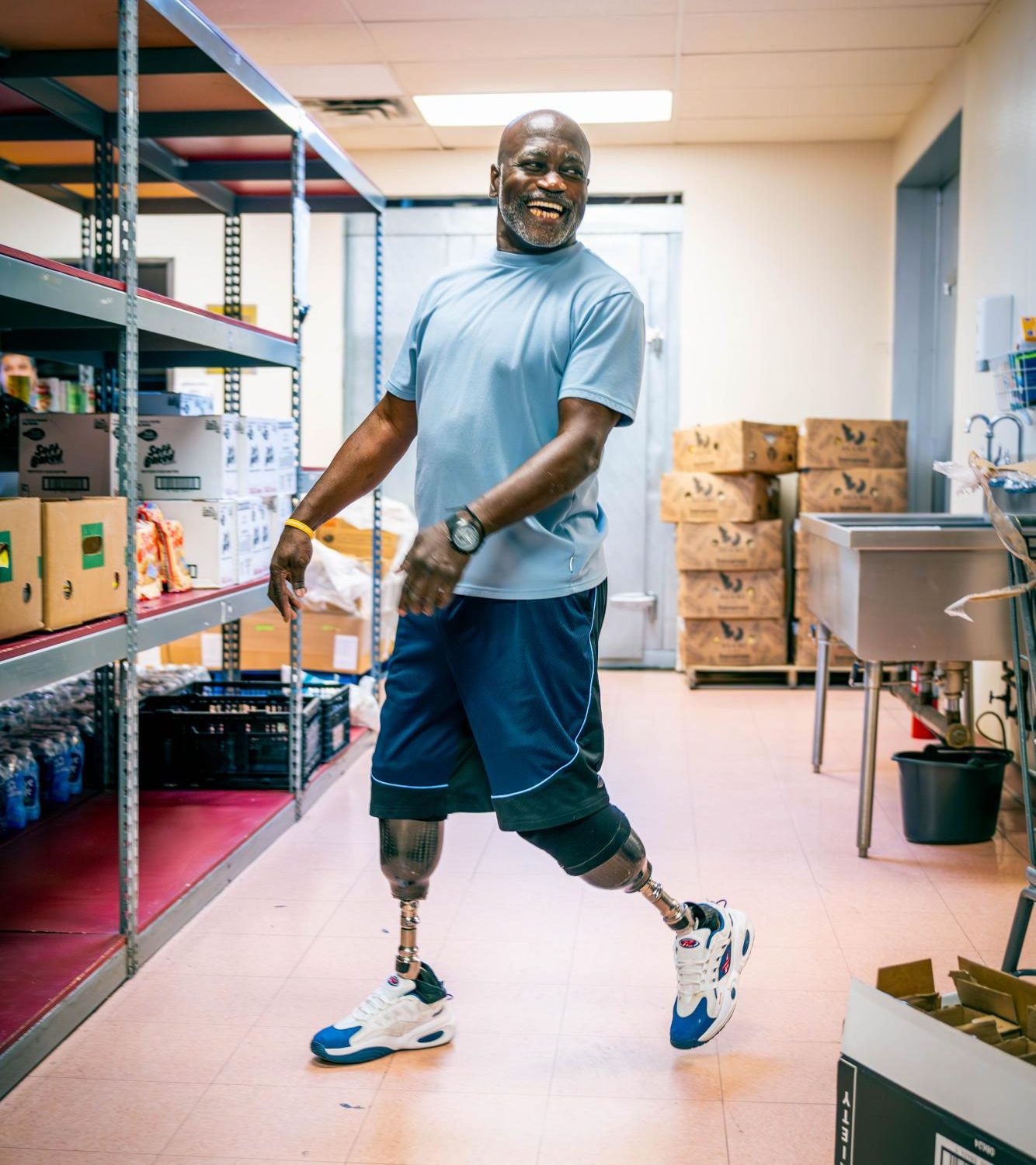 NW student Vangregory Grinnon volunteers in the Northside Inter-Community Agency food pantry. 
