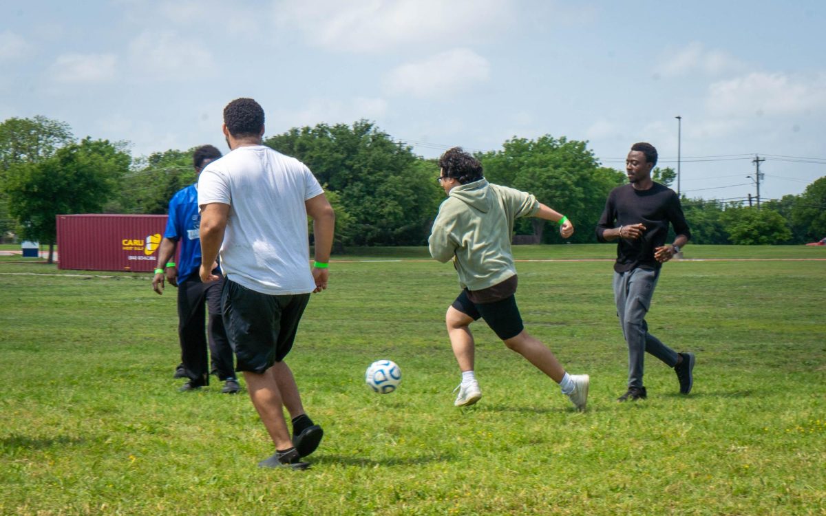 Students compete in a game of soccer during the Field Fest event on SE Campus.