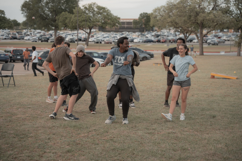 NE students and Revival Today church members dance to “Macarena” at the community event on March 31. Over 20 students attended the event where they enjoyed free pizza, drinks and won prizes in a giveaway.