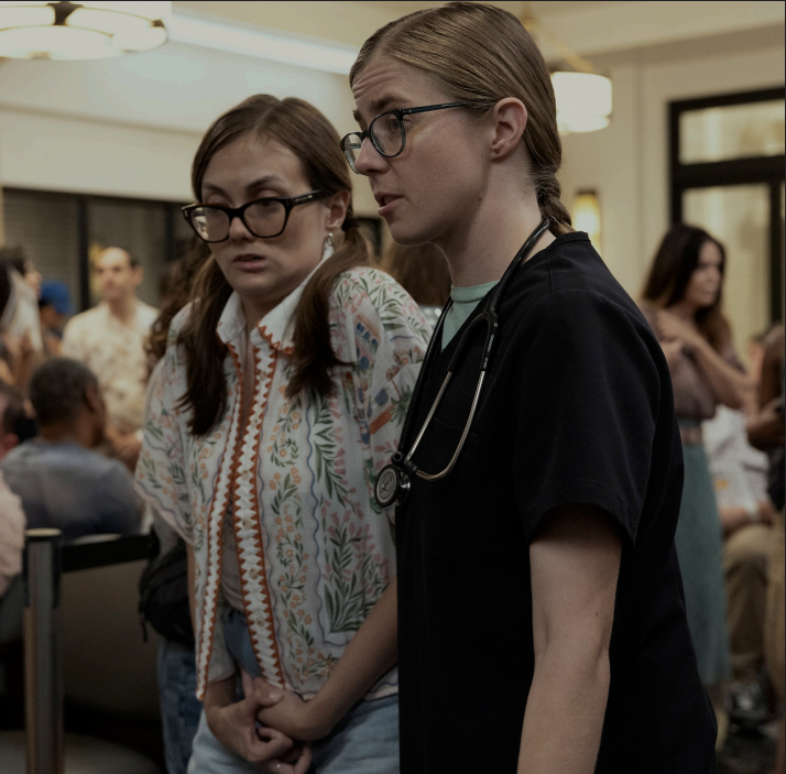 "The Pitt” character Dr. Mel King guides her sister Becca, who has autism, 
through the Pittsburgh Trauma Medical Center waiting room. 