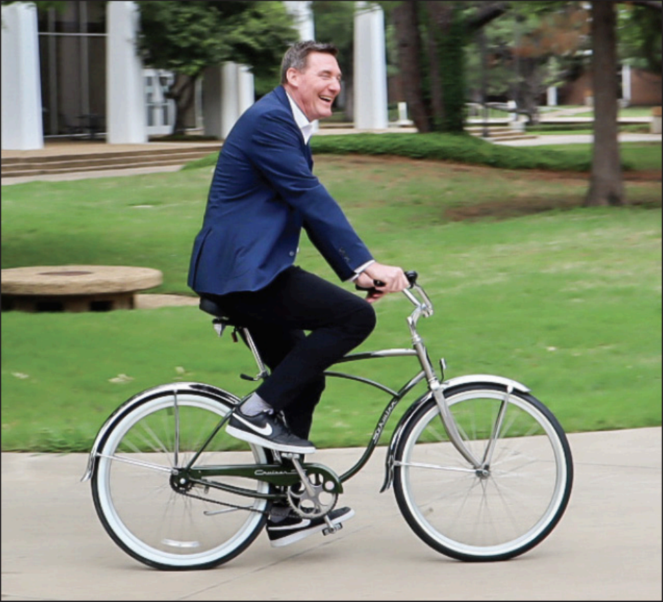 South Campus President Dan Lufkin rides his bike through the open walkways 
of the campus. He said he uses his bike to get to meetings faster and greets 
students, staff and faculty along the way. He has been president for four years. 
He said he also plays basketball on campus in the mornings for a workout