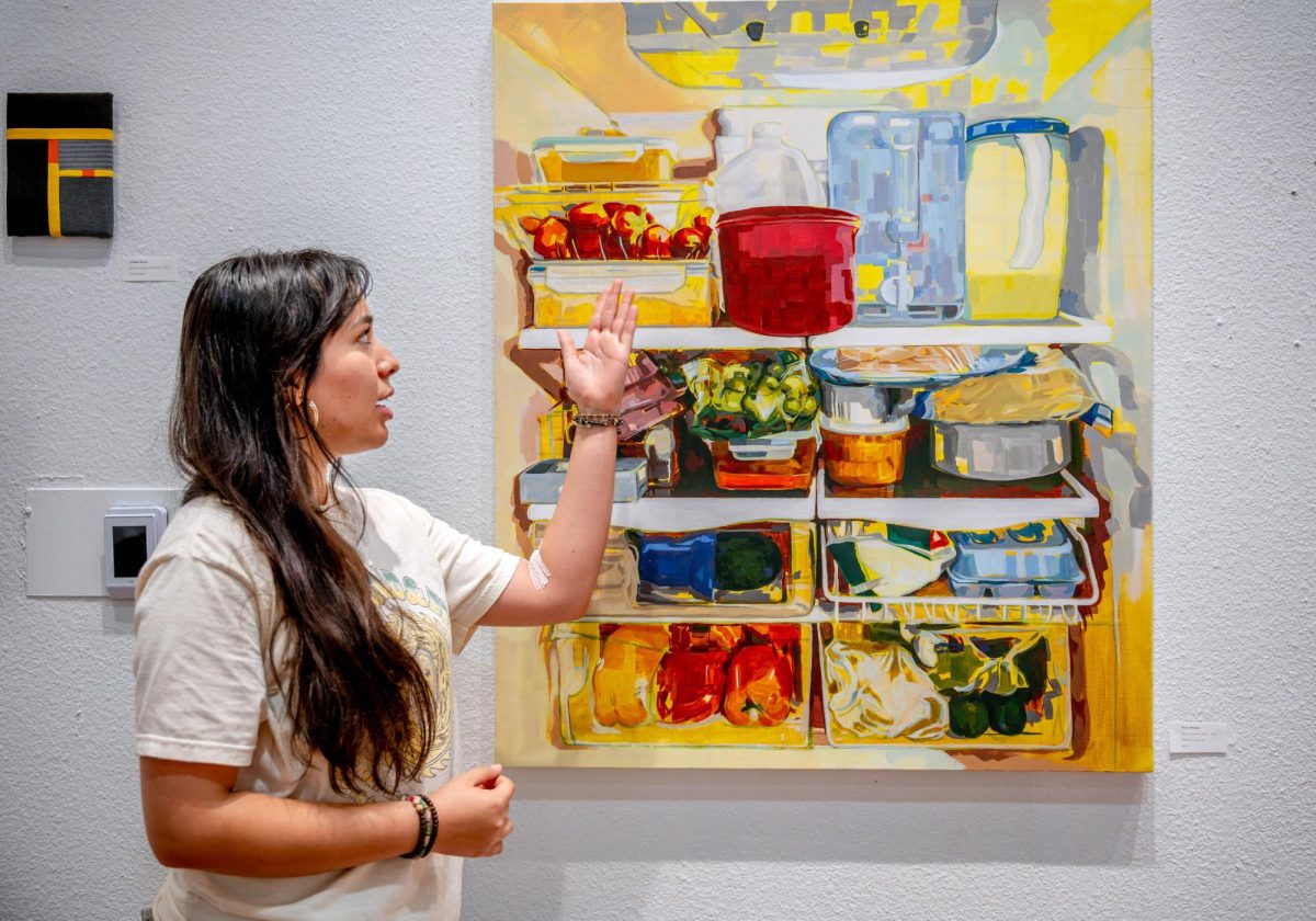TCC alum Paola Mendez chose to paint "There's Food at Home" in an impressionist style and in exact proportion to her mom's refrigerator at home. 