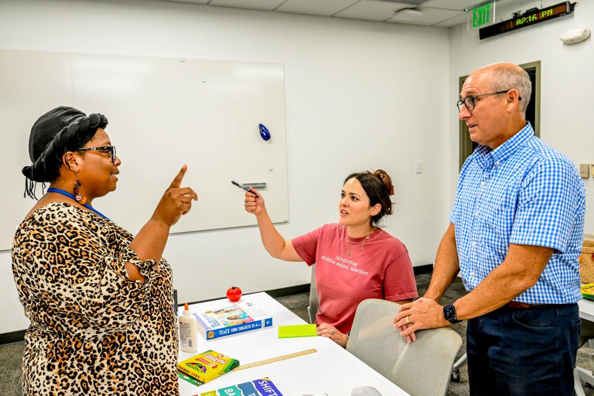 South education instructor Niesha Jones tells instructor Rebecca Luig and director Jeffrey Herr 
that she is looking forward to helping her students start their college journey this semester