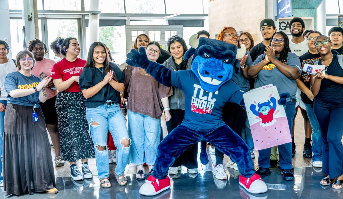 Toro shows off his birthday card with TR students and staff at the "Toro the Trailblazer Birthday Bash" on Aug. 18.